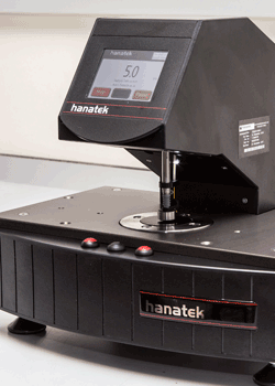 A digital deadweight micrometer performing a spot thickness test.