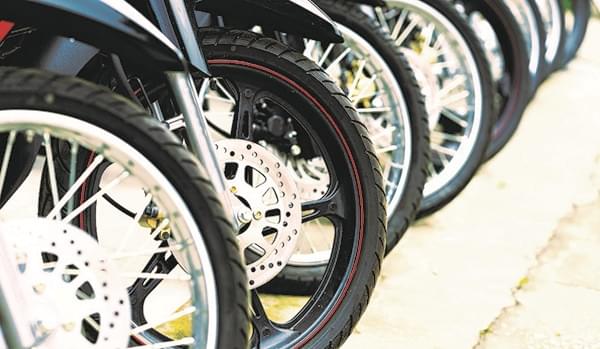 How does the emergence of electric motorcycles create implications for tires?